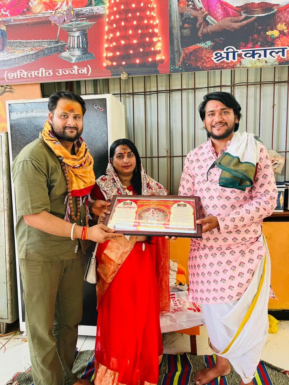 Family Receiving Puja Certificate